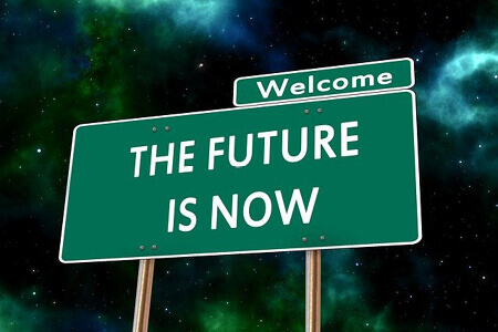 Blog | BPO ist das Modell der Gegenwart | Gruenes Schild mit weißer Schrift | Welcome THE FUTURE IS NOW
